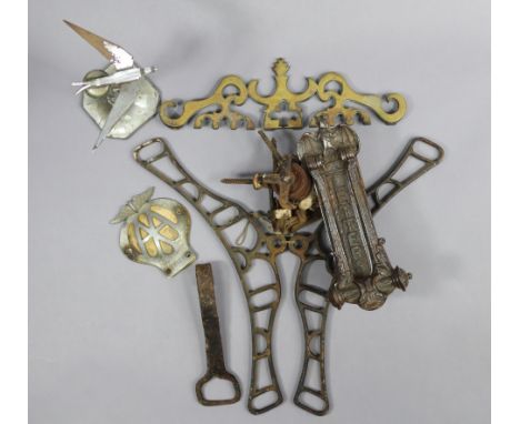 A novelty cast-iron bat door knocker; an “AA” car membership badge; a “Swift” car mascot, etc.