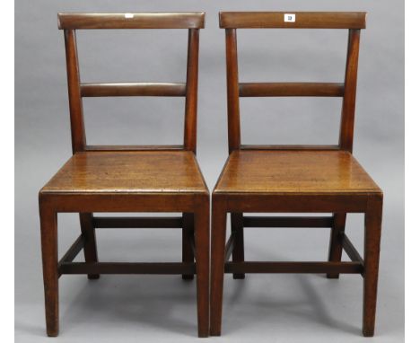 A pair of cottage rail-back dining chairs, with hard seats &amp; on square tapered legs with plain stretchers.