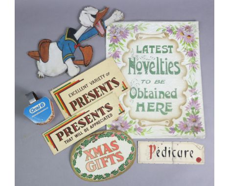 Five various vintage cardboard shop signs; a glass negative plate, etc.