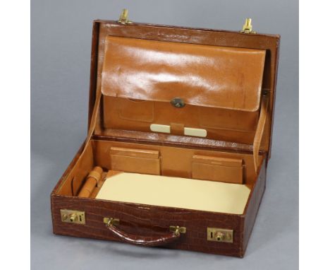 AN ASPREY OF LONDON CROCODILE LEATHER GENT’S TRAVELLING CASE with fitted interior &amp; with canvas outer case, 15” wide x 6.