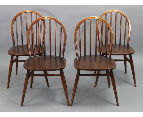 A set of four Ercol spindle-back dining chairs with hard seats, &amp; on round tapered legs with spindle stretchers; &amp; an