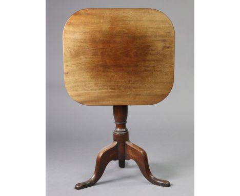 A Georgian mahogany tripod table with rectangular tilt top, on vase-turned centre column with three cabriole legs &amp; pad f