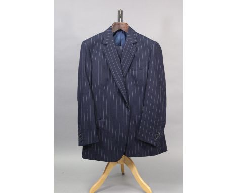 A navy blue pinstriped suit jacket and matching trousers, tailored by Huntsman &amp; Son Ltd. of Saville Row, 26.03.2009; app