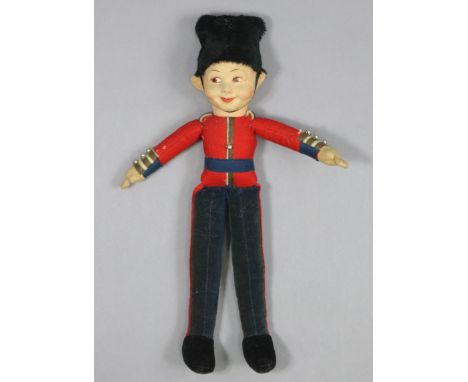 A vintage Lenci-type boy soldier cloth doll, 14½” high.