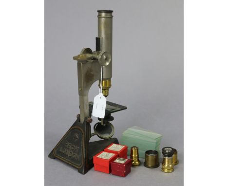 A Vintage Beck of London monocular microscope (No. 13974), with various accessories.
