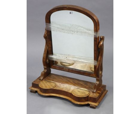 A 19th century mahogany rectangular swing toilet mirror on pierced &amp; shaped end supports, &amp; with two hinged compartme