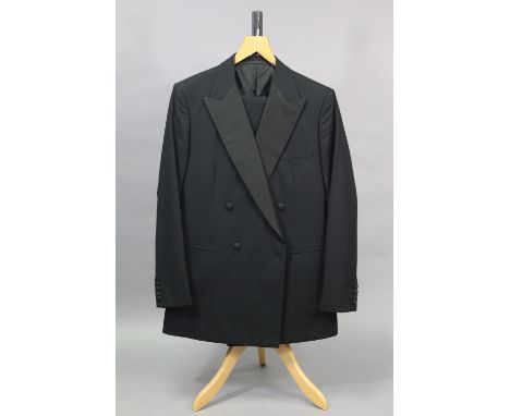 A black dinner jacket with matching trousers, tailored by H. Huntsman &amp; Sons Ltd. of Saville Row, 14.7.1988; approx. meas