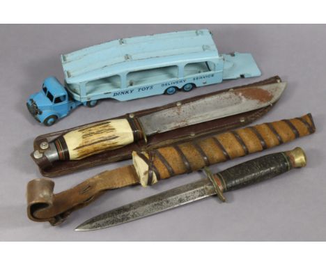 A Dinky die-cast scale model “Pullmore Car Transporter” (No. 982), unboxed; together with two bowie knives, each with sheath.