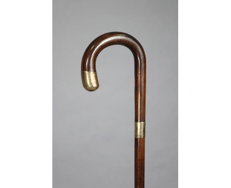 A vintage rosewood gent’s walking cane with two 9ct. gold mounts, 35.75” high.
