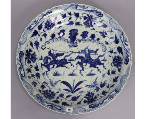 A Chinese porcelain large dish with blue &amp; white decoration of warriors to centre, 24” diameter; together with nine vinta