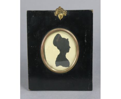 A 19th century silhouette portrait miniature of Sarah Bull (oval), 3” x 2¼”, in ebonised frame.