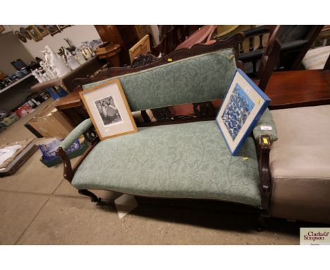 An Edwardian green upholstered salon sofa