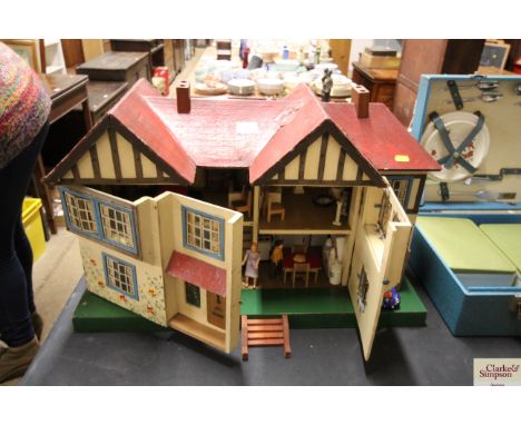 A vintage Tri-ang doll's house and contents