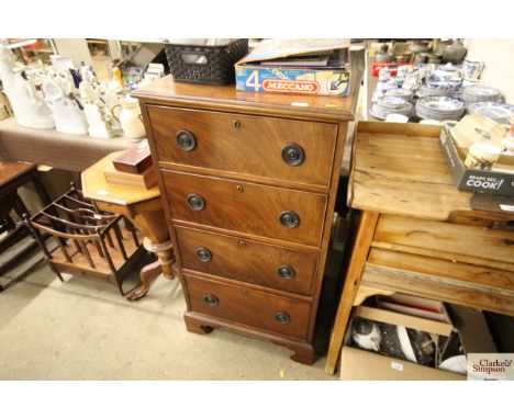 A mahogany chest fitted four long drawers raised on  bracket feet