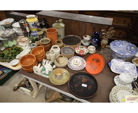 Two lacquered trays, stoneware plates and bowls, a pair of gilt ewers, Quimper ware etc.