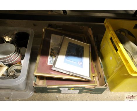 A box of various pictures and prints