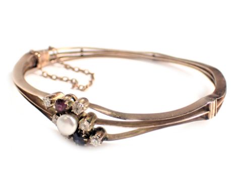 A hinged bangle, of three splay design, set with tiny diamonds, ruby, sapphire and cultured pearl, each with three set sectio