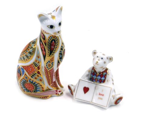 A Royal Crown Derby porcelain cat, decorated in Imari colours, and a model of a Teddy bear I Love You. (2) 