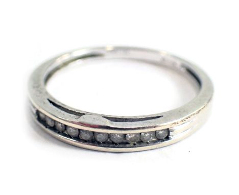 A 9ct white gold half hoop dress ring, set with tension set tiny diamonds, ring size N½, 1.9g all in. 