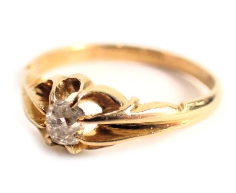 A diamond dress ring, the cushion cut diamond in eight claw setting, with petalated border, yellow metal stamped 18kt, ring s