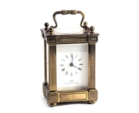 A modern Matthew Norman brass carriage clock, with column supports and original box, 12cm high. 