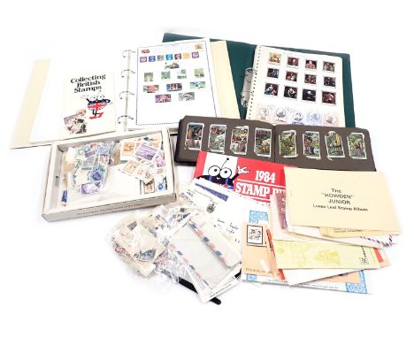 Philately and Deltiology. A group of loose postally worn stamps, a cigarette card album of cricket players, worlds series sta