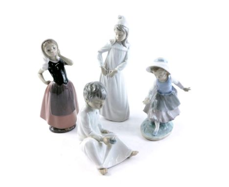 Four Nao figures, comprising girl in pink flowing dress, girl in night gown, girl dancing, and a child with night light. (4) 