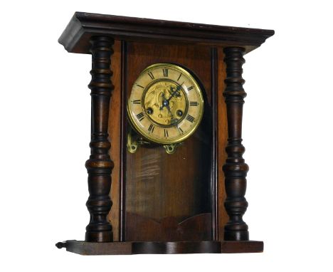 An early 20thC Vienna style wall clock in walnut case, with papered dial, 43cm high. (AF)