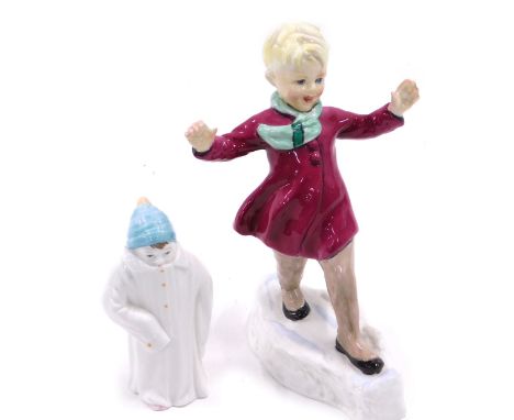 A Royal Worcester porcelain figure, January, modelled by Freda Doughty, and a Royal Worcester toddie candle snuffer. (2) 