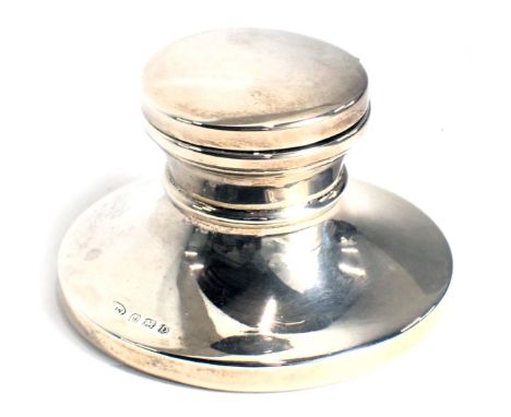 A George VI silver capstan shaped inkwell, with loaded base, Birmingham 1938, 8.5cm diameter. 