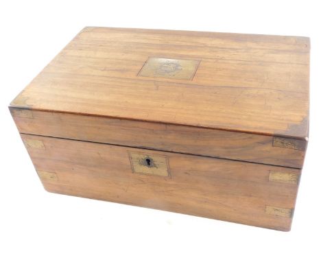 A late Victorian walnut writing slope, with brass bound decoration and central shield baring the initial SB, stamped Xmas 190