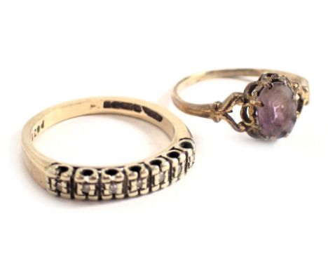 Two dress rings, comprising a 9ct gold and amethyst set dress ring, ring size M½, and a 9ct gold diamond set half hoop dress 