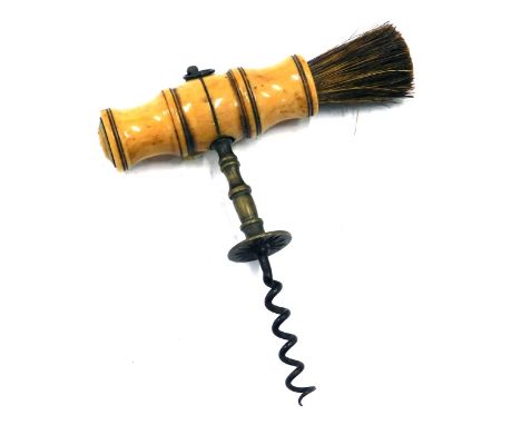 A 19thC brass corkscrew, with turned bone handle and brush, 14cm long. 