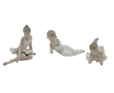 Three Nao figures, comprising two ballerinas, and a reclining child. (3) 