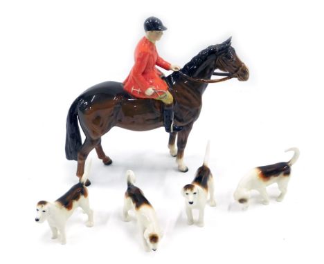 A Beswick part hunting set, comprising huntsman on brown horse and four hands. 