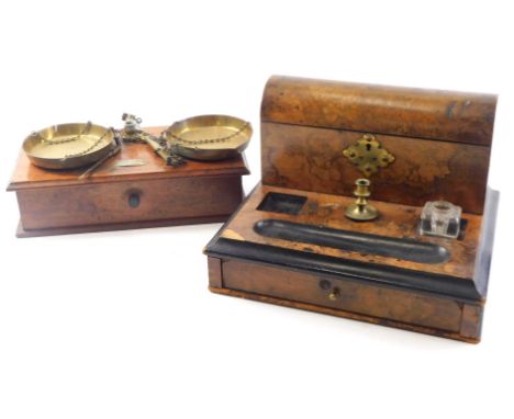 A Victorian burr walnut and ebonised desk stand, with single brass candlestick associated inkwell etc. (AF) 32cm wide, and a 