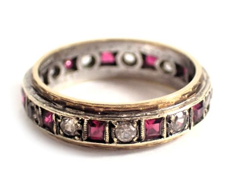 A diamond and ruby set eternity ring, with arrangement of round brilliant cut diamonds and square cut rubies, yellow metal se