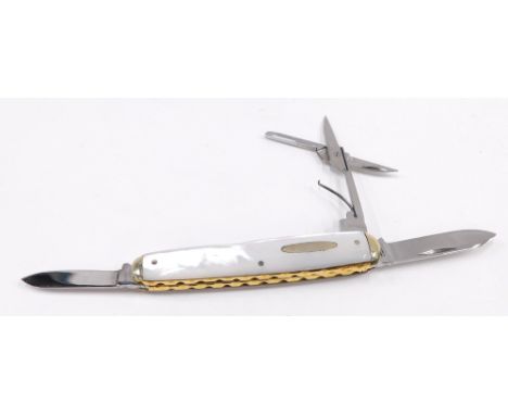 A mother of pearl and brass inlaid pen knife. 