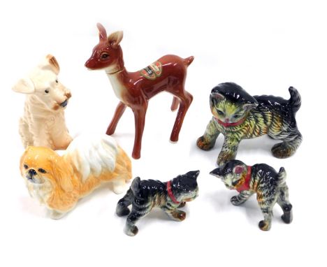 A collection of figurines, to include Sylvac terriers, ceramic kittens stamped M, and a Rynbende cherry brandy deer, lacking 