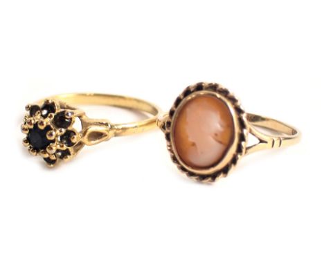 Two dress rings, comprising a cameo dress ring with rope twist border, yellow metal stamped 9ct, ring size P½, and a further 