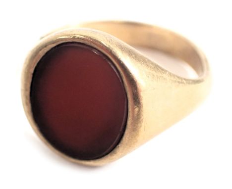 A 9ct gold signet ring, with oval orange agate in rub over setting, on a plain band, ring size T½, cut, 7.2g all in. (AF) 