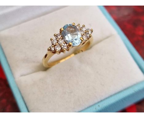 14ct Gold Ring with blue and white stones, size O and 2.67g