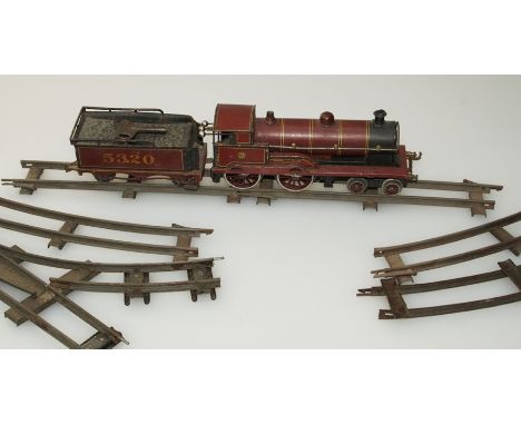 Bassett Lowke, an 'O' guage clockwork locomotive and tender George the Fifth, together with various curved and straight tack 