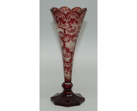 A 19th century Bohemian ruby and clear etched glass vase of trumpet form, decorated with palaces, deer and trellis reserves, 