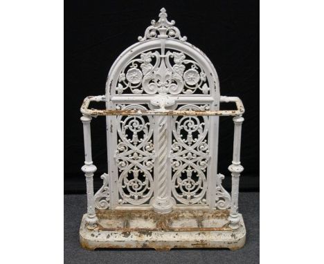 A Victorian Falkirk cast iron two division stick stand, with drip trays, on bracket plinth. Lozenge registration mark, 103 x 