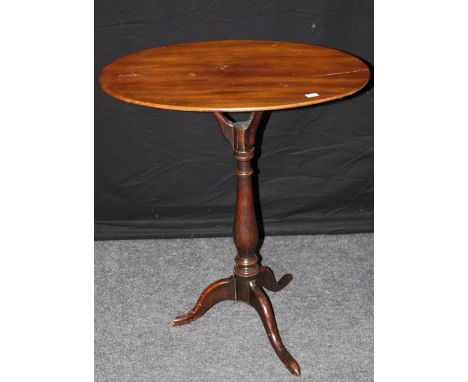 A mahogany and fruitwood occasional table, the oval top having a unusual snap top over a turned column, on tripod legs. Georg