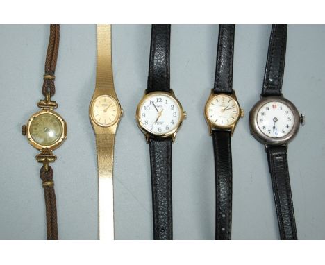 An early 20th century lady's gold cased wristwatch with engine turned 15mm Roman dial, a lady's silver cased 'red twelve' wri