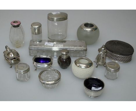 Four silver mounted glass dressing table jars, two scent bottles with silver caps, a three piece silver condiment, perfume at