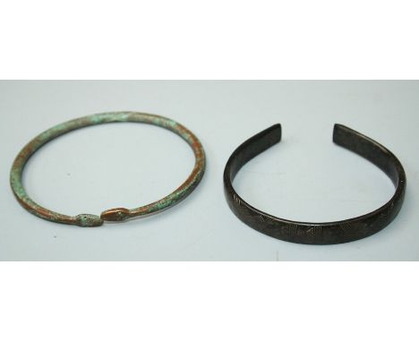A European bronze Bracelet, with incised banded and chevron decoration, approx. 7cm together with a Roman style bronze bracel