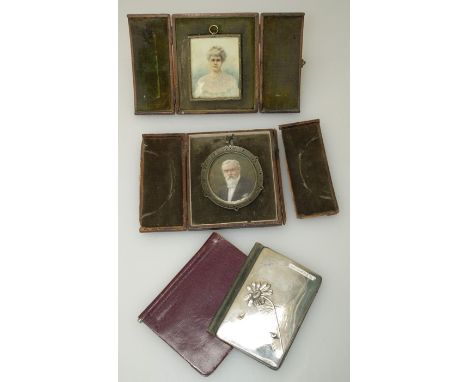 Two Edwardian miniature over painted portrait photographs of an elderly gentleman and lady, each in leather case, together wi